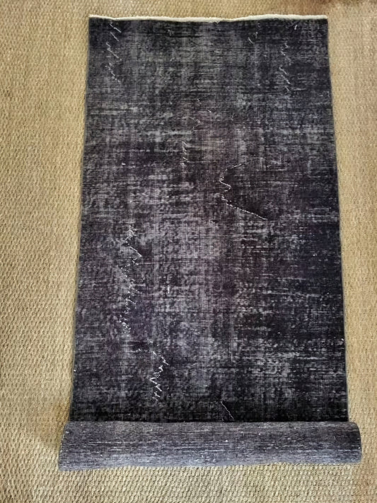 Tapis noir et gris fait-main